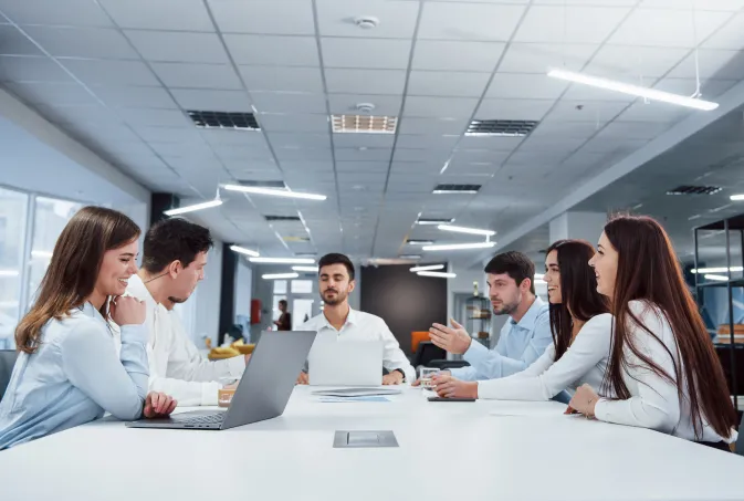 friendly atmosphere group young freelancers office have conversation smiling